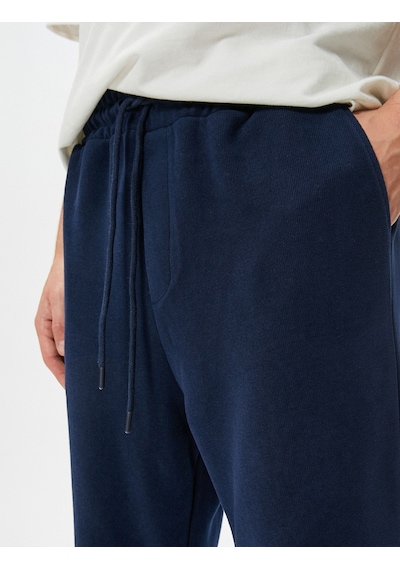 Koton Oversize Eşofman Altı Beli Bağcıklı Bol Paça Cep Detaylı Lacivert 4sam40043mk Lacivert