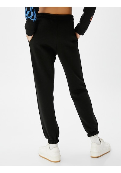 Koton Jogger Eşofman Altı Beli Bağcıklı Cep Detaylı Nakışlı Siyah 4wal40038ık 4WAL40038IK999 Siyah Koton Jogger Eşofman Altı Beli Bağcıklı Cep Detaylı Nakışlı Siyah 4wal40038ık 4WAL40038IK999 Siyah