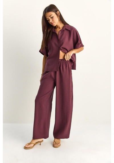 Shade Kadın Oversize Kısa Kol Gömlek Beli Lastikli Geniş Paça Pantolon Takım 7651 60286138 - Mürdüm Shade Kadın Oversize Kısa Kol Gömlek Beli Lastikli Geniş Paça Pantolon Takım 7651 60286138 - Mürdüm