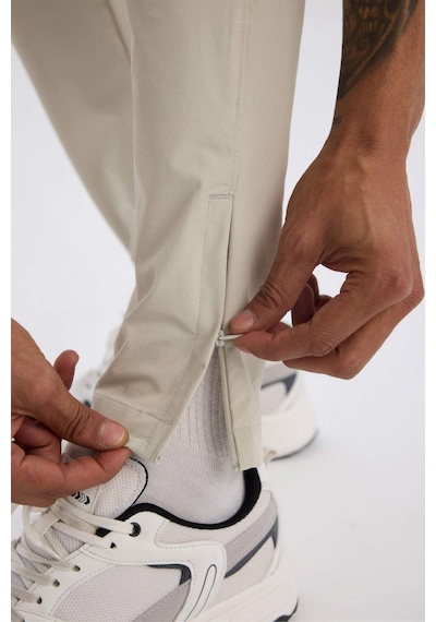 DeFactoFit Esnek Kumaş Sporcu Jogger Eşofman Altı Slim Fit Dar Kesim Dokuma Üç Cepli Fermuarlı Paça B2780AX25SPBG779