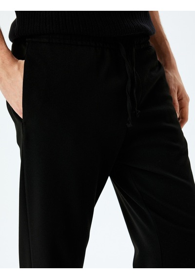 Koton Viskon Karışımlı Cep Detaylı Beli Bağcıklı Eşofman Pantolon Siyah 5sam40088hw Siyah Koton Viskon Karışımlı Cep Detaylı Beli Bağcıklı Eşofman Pantolon Siyah 5sam40088hw Siyah