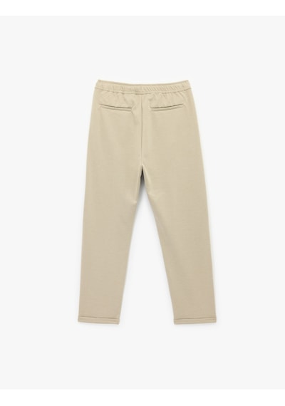 Koton Straight Fit Pike Kumaş Cep Detaylı Rahat Kesim Beli Bağcıklı Pantolon Taş 6wam40006hk Taş Koton Straight Fit Pike Kumaş Cep Detaylı Rahat Kesim Beli Bağcıklı Pantolon Taş 6wam40006hk Taş