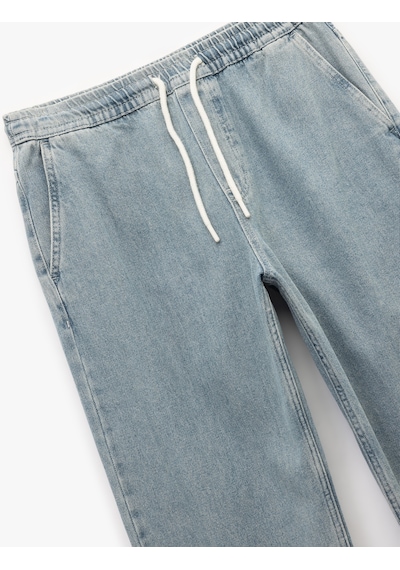 Koton Beli Bağcıklı Cep Detaylı Pamuklu Rahat Kesim Jogger Denim Pantolon İndigo Stone 6wam40082nd İndigo - Taş Koton Beli Bağcıklı Cep Detaylı Pamuklu Rahat Kesim Jogger Denim Pantolon İndigo Stone 6wam40082nd İndigo - Taş