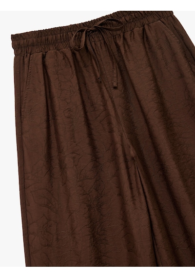 Koton Modal Kumaş Cepli Beli Lastikli Bağlamalı Floral Dokulu Geniş Paça Pantolon Kahverengi 6wak40102pw Kahve
