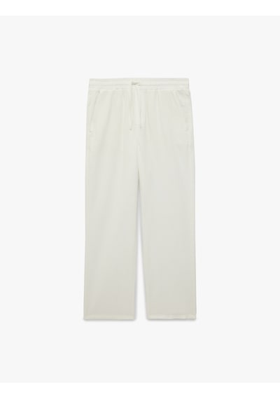 Koton Regular Fit Pamuklu Cepli Beli Bağcıklı Lastikli Pantolon Beyaz 7wam40050hw