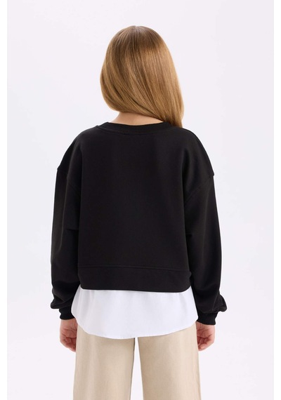 DeFacto Kız Çocuk Relax Fit Bisiklet Yaka Etek Ucu Detaylı Sweatshirt D0703A824AUBK81 Siyah