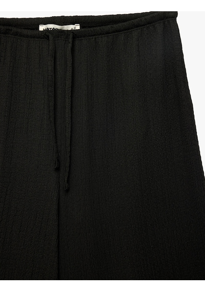 Koton Bürümcük Kumaş Beli Bağcıklı Düz Geniş Paça Pantolon Siyah 6sak40111ek