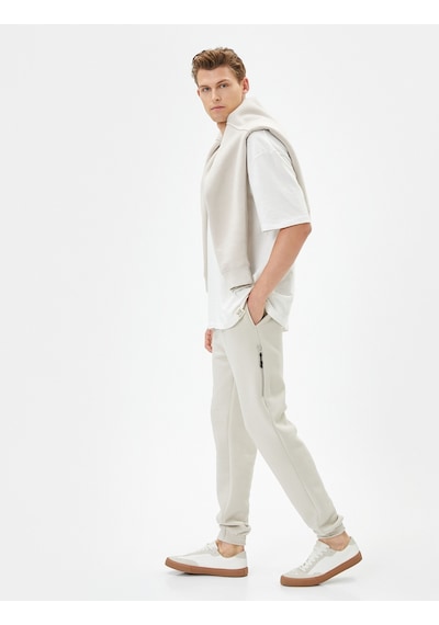Koton Jogger Eşofman Altı Beli Bağcıklı Fermuar Detaylı Cepli Bej 4sam40038mk 4SAM40038MK050 Ekru Koton Jogger Eşofman Altı Beli Bağcıklı Fermuar Detaylı Cepli Bej 4sam40038mk 4SAM40038MK050 Ekru