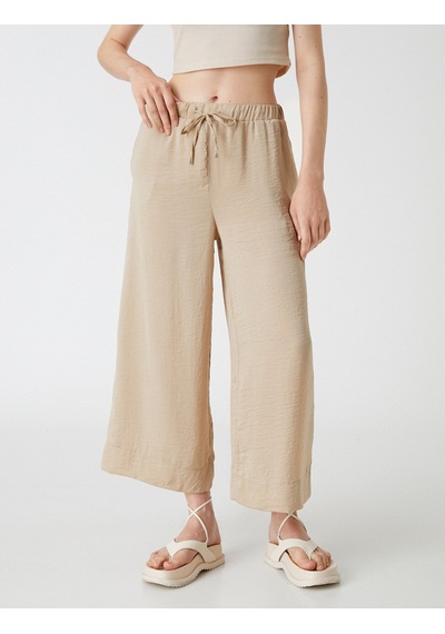 Koton Crop Pantolon Bol Paça Beli Bağlamalı Saten Görünümlü Taş 2sak40119pw Taş