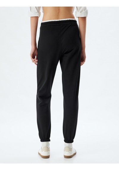 Koton Jogger Eşofman Altı Çift Bel Detaylı Bağcıklı Şardonlu Cepli Rahat Kalıp Siyah 5wal40066ık Siyah Koton Jogger Eşofman Altı Çift Bel Detaylı Bağcıklı Şardonlu Cepli Rahat Kalıp Siyah 5wal40066ık Siyah